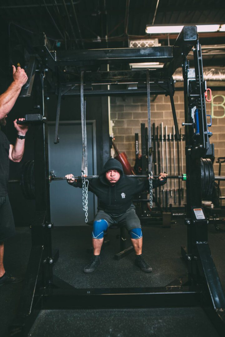 Person lifting weights in a gym.
